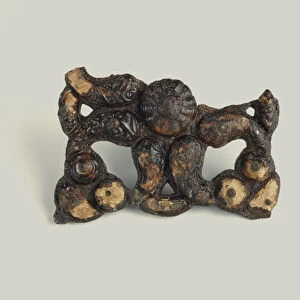 Iron and bronze ornament, with coral, 350-300 BC