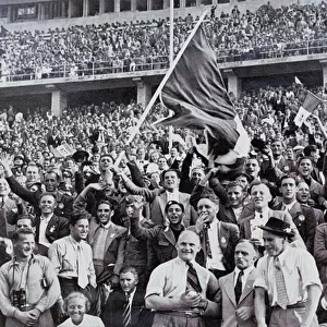 Italian fans supporting their athletes in the stadium at the Olympic Games, Berlin, Germany, 1936 (b / w photo)