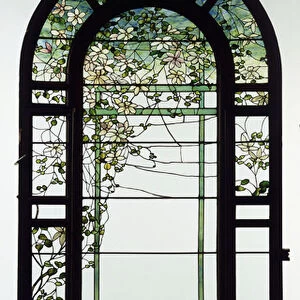 A leaded glass trellised window depicting clematis vines