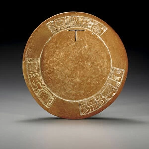 A Mayan carved plate, with a T boldly cut-out