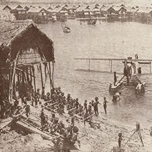 Papuans investigating a seaplane (b / w photo)