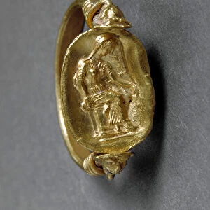Ring with scarab, on the base is depicted seated Electra, with bowed head
