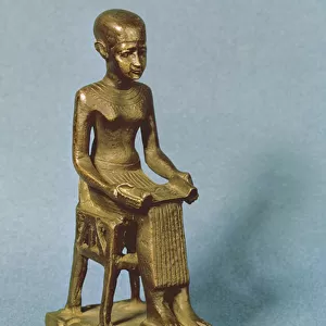 Seated statue of Imhotep (fl. c. 2980 BC) holding an open papyrus scroll