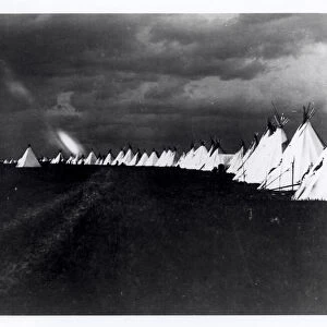 Sioux teepees in a line during a lightning storm, North or South Dakota, c. 1902 (b / w photo)