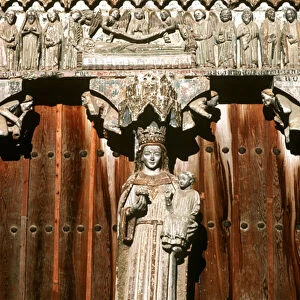 The west portal with statue of Madonna and Child and relief of the Last Judgement (photo)