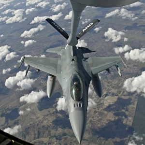 A Chilean Air Force F-16 refuels from a U. S. Air Force KC-135 Stratotanker
