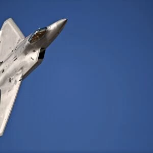 An F-22 Raptor aircraft performs during Aviation Nation 2010