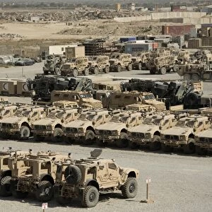 Rows of heavy vehicles and supplies at Camp Warrior, Afghanistan