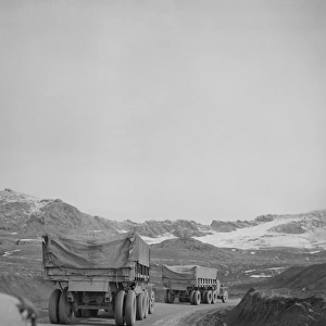 A U. S. Army truck convoy climbing a mountain pass somewhere in the Persian corridor, 1943