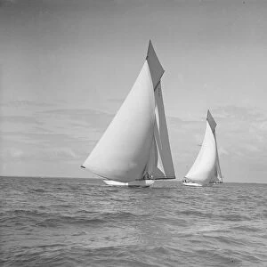The 19-metre class Mariquita & Corona race downwind under spinnaker, 1911