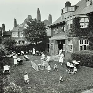 Children and carers in a garden, Hampstead, London, 1960