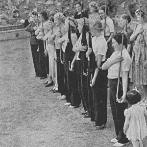 Members of the Womens Volunteer Defence Corps being trained in rifle drill, World War II, 1940