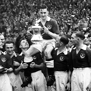 Jimmy Guthrie, Portsmouth captain, holding the F. A. Cup