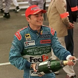 1998 MONACO GP. Giancarlo Fisichella, Benetton, sprays the celebration champagne after finishing 2nd in Mont Carlo behind Mika Hakkinen. Photo: LAT