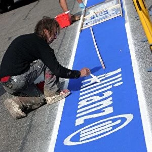 Formula One World Championship: Allianz branding is painted in the pitlane