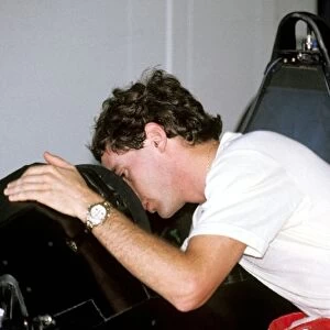 Formula One World Championship: Ayrton Senna peers into the cockpit of his McLaren MP4 / 5