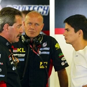 Formula One World Championship: John Walton Minardi Sporting Director talks with Alex Yoong and Greg Wheeler Race Engineer at Minardi