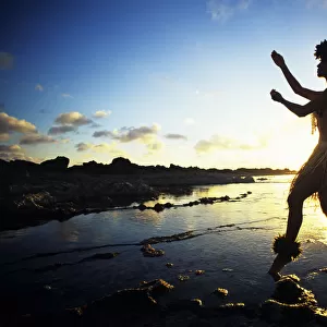 Hawaii, Female Hula Dancer On Beach, Silhouetted By Sunset