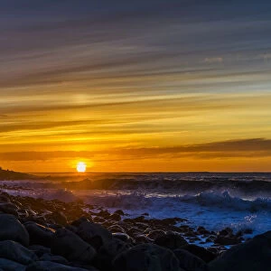 The Sun Sets Over The Ocean On The Oregon Coast; Seaside, Oregon, United States Of America