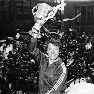 Alex Ferguson holding the Scottish league championship trophy after winning the Scottish