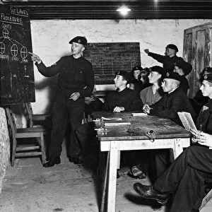 Blackboard diagrams assist this class of members of a West Country Tank Corps unit in
