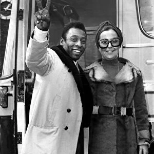 Brazilian football star Pele with his wife Rosa as he arrives in London to play football