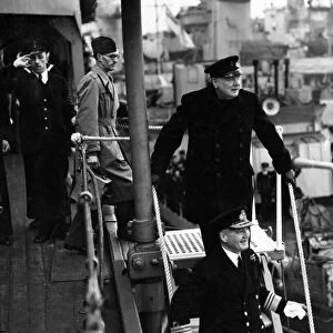 British Prime Minister Winston Churchill leaves a destroyer depot during his visit to