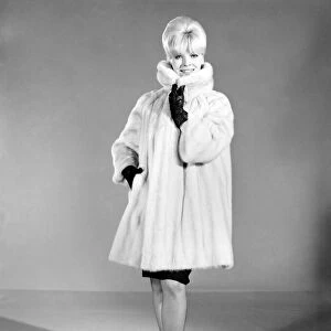 Clothing: Fashion: Fur Coat: Woman (Marion Horton) wearing mink fur coat. 1966 B1952-002