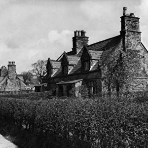 Cottages on Church Road, Knowsley Village, with church in background, 28th March 1950