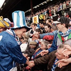 David Robertson Rangers football player with Ian Durrant both wearing hats greet the fans