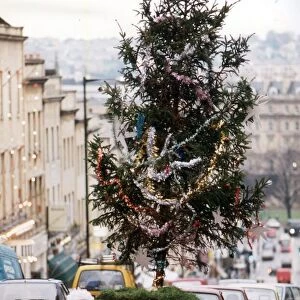 Ian Johnson drives his Ford Capri with a Christmas tree on the roof of the car