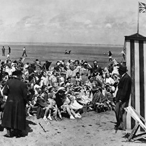 The Inevitable Punch and Judy show on the crowded Southport beach. 12th July 1950