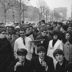 John Lennon, Paul MCCartney and George Harrison on the Champs Elysees before Ringo