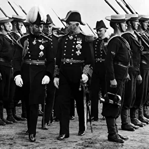 King George V seen here inspecting a naval guard of honour during a visit to Aberystwyth