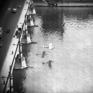 Mad Major Christopher Draper flying under Westminster Bridge in an Auster aircraft