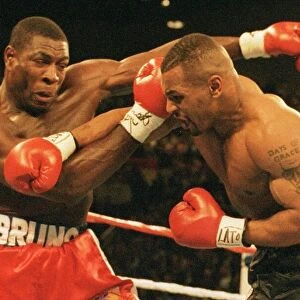 Mike Tyson launches an attack on Frank Bruno during the WBC world title fight in Las