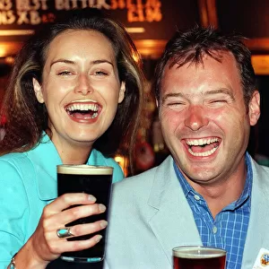 Model Eileen Catterson and TV Presenter John Leslie having some fun at the launch of