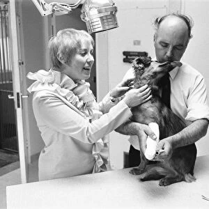 Mrs Sindy Bell seen here helping vet Robert White during the opening of a new wing by