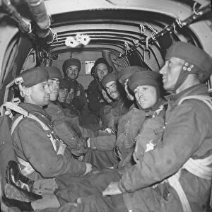 Parachutists inside the bomber plane awaiting the call to jump. Training picture
