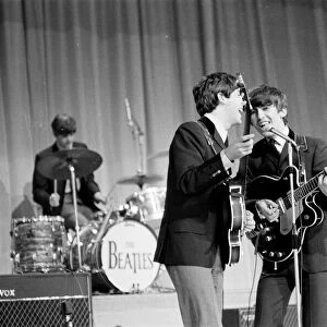 Picture shows Paul McCartney (left) and George Harrison (right) sharing the microphone