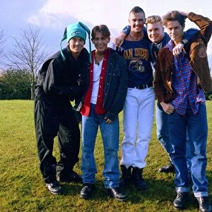 Pop group Take That pose for group photographs. Left to right are: Robbie Williams