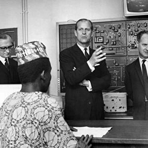 Prince Philip, Duke of Edinburgh talks to some of the students in the Radio laboratory at