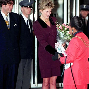 PRINCESS OF WALES WEARING A PURPLE SKIRT SUIT RECEIVING FLOWERS OUTSIDE THE NATIONAL