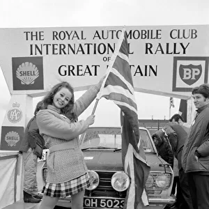 R. A. C. Rally: Miss U. K. Sheena Drummond, Waves the flag for the start of the R. A. C. Rally