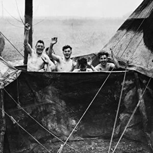Soldiers of the British Expeditionary Force in Northern France give a wave to camera as