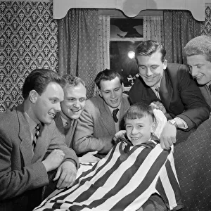 Thirteen year old Denis Homer of Dudley, Worcestershire is visited by footballers of