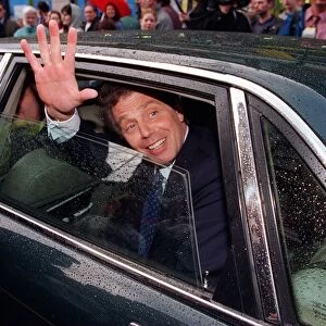 Tony Blair waving from inside car while in Stirling. 1990s