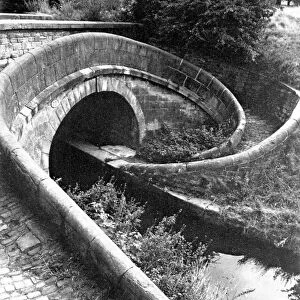 A Turnover bridge, designed to take the towpath from one oside of the canal to the other