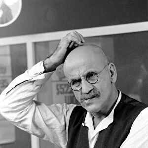 Warren Mitchell scratches his head trying to decide which team he wants to win the cup