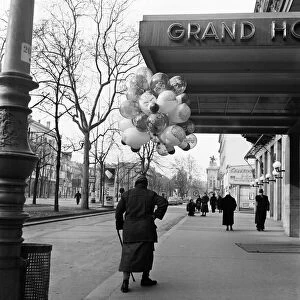 A woman selling balloons in Vienna. For hours the old lady of Vienna had tramped the cold